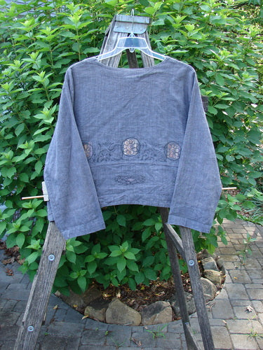 Barclay Hemp Cotton Cayman Shirt Blue Denim Circle Floral Size 0, displayed on a wooden ladder, showcases a fun widening bottom panel with a continuous floral pattern and sweet front shell buttons.