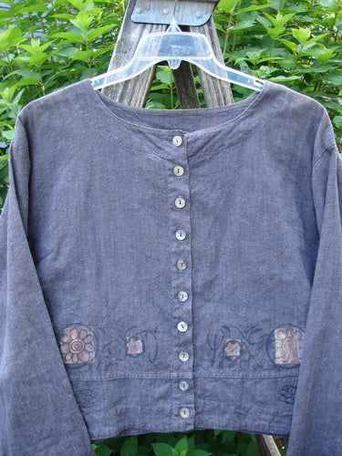 Barclay Hemp Cotton Cayman Shirt in Blue Denim, featuring a circle floral design and buttoned collar. The long sleeves and A-line flair enhance its dynamic drape. Perfect for expressing individual style.