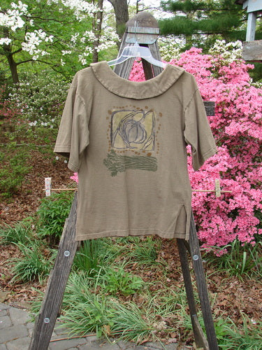 1994 Compass Top Wind Garden Bark Size 1 on a wooden stand, featuring a large pointed collar, original buttons, side vents, and detailed garden-themed design.
