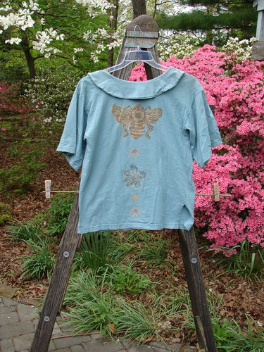 1994 Compass Top Garden Bee Dusk Size 1 with pointed collar, original buttons, side vents, and garden bee theme paint, displayed on a ladder.