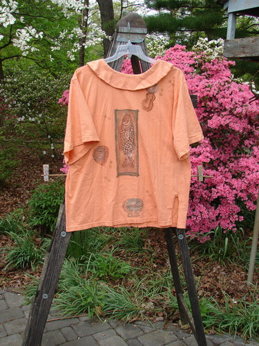 1994 Compass Top Beach Shell Music Reef Size 2, displayed on a hanger, featuring an exaggerated collar, side vents, vintage buttons, and mixed sea life and music themes, from BlueFishFinder.com.