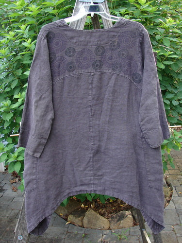 Barclay Hemp Cotton Summercloth Dip Side Pocket Jacket Pinwheel Brum Size 1 displayed on a clothes rack, showcasing its three-quarter sleeves, deep V-neckline, dual pockets, and distinct dipped sides.