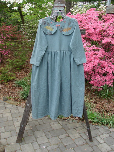 1992 Silly Collar Dress Spin Leaf Grey Green Size 1 displayed on a rack, showcasing its button-on sailor collar, long sleeves, and gathered waist with a sweeping A-line shape.