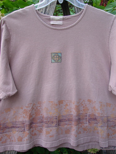 2000 Short Sleeved Crop Tee Floral Fence Border Coralline Size 2, featuring elbow-length sleeves, square motif on chest, abstract patterned hem, hung outdoors on a clear hanger, showcasing Bluefishfinder's creative vintage style.