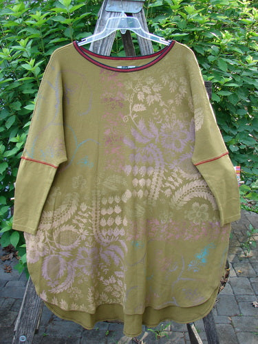 Barclay Thermal Contrast Revival Top Botanicals Yellow Olive OSFA, featuring a unique botanical pattern, ribbed neckline, tapering sleeves, and side vents, embodies Blue Fish Clothing's vintage-inspired creativity and individuality.