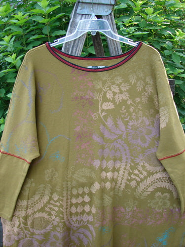 Barclay Thermal Contrast Revival Top Botanicals Yellow Olive OSFA displayed on a wooden ladder with intricate ribbed sleeves, rounded neckline, and botanical-themed design, emphasizing vintage-inspired creativity from BlueFishFinder.com.