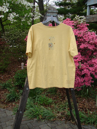 2000 Artist Choice Short Sleeved Tee Tree Key Lime Pie Size 1 displayed on a wooden hanger, showcasing a single tree design, drop shoulders, and a rolled neckline, emphasizing its vintage Blue Fish Clothing style.