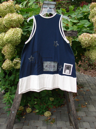 1998 8 Ball Tunic Games Crew Blue Size 1 features a sleeveless design with navy body and white accents, star appliqués, front graphic pocket, and printed patch, displayed on a wooden ladder outdoors.