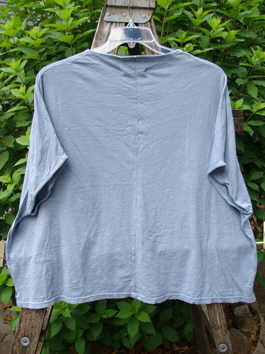 Barclay Cotton Slub Cricket Cap Sleeve Tee Sun Guy Dusty Blue OSFA displayed on a hanger, showcasing its seamless shoulder design, cap sleeves, and slight hip flare from Bluefishfinder.com’s vintage-inspired collection.