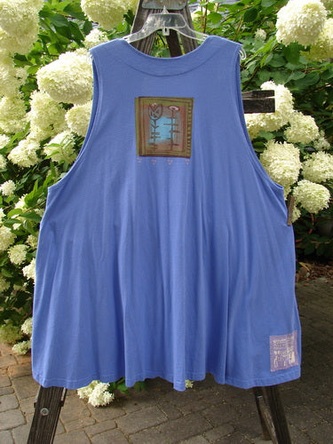 1997 Simple Vest Flower Sprig Skylark Size 2: Blue tank top with a flower design, coordinating buttons, and a Blue Fish patch on the lower back.