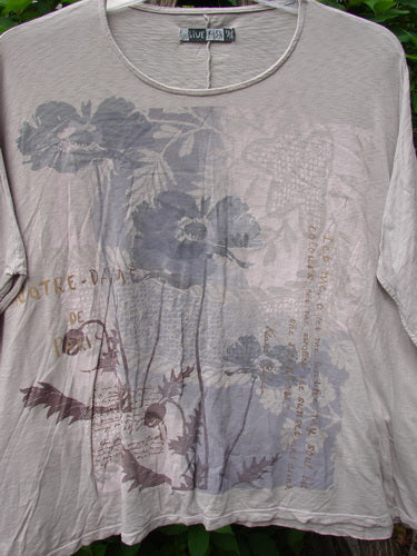 Barclay Cotton Slub Cricket Cap Sleeve Tee in Poppy Garden Mist, featuring floral patterns, seamless shoulder sleeves, and a slightly flared hip design, showcasing BlueFishFinder's unique vintage style.