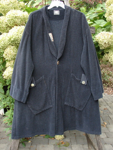 1999 Patched Chenille Angle Pocket Jacket Holiday Black Size 1 with shawl collar, oversized button at mid-chest, and two large patch pockets, hanging on a hanger outdoors.