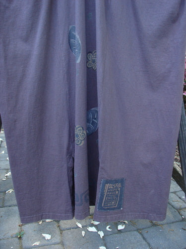 1995 Omega Jumper Magic Leaf Bloomsberry OSFA hanging on a clothesline, showcasing its wide front bib with a buttoned front pocket and apron-style look.