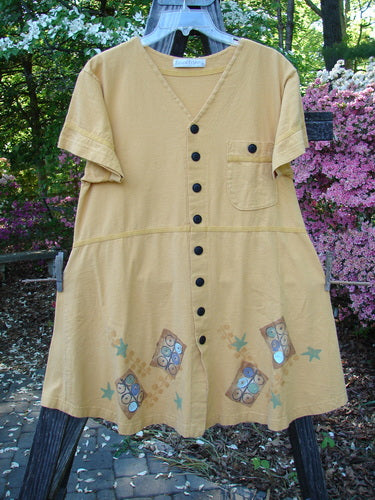 1998 Baseball Dress Games Lemonade Size 0 featuring a deeper V-shaped neckline, dark contrasting buttons, paneled breast pocket, drop waist seam, A-line lower sweep, and classic game theme paint on a swing.