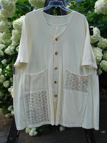 2000 Double Decker Pocket Top Pastel Fence Milk Size 2, featuring two oversized front pockets and pleated backline, made from organic cotton.