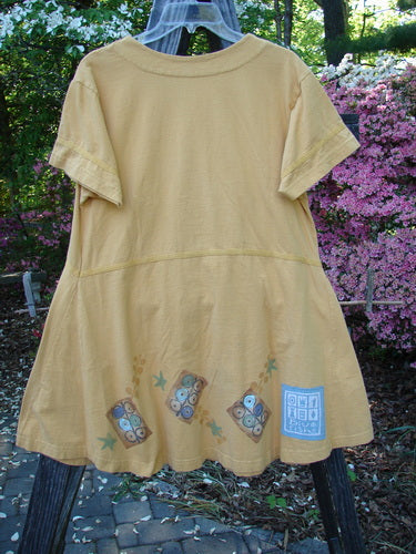 1998 Baseball Dress Games Lemonade Size 0 displayed on a hanger, featuring a deep V-neckline, dark buttons, a paneled breast pocket, drop waist seam, and an A-line lower sweep.