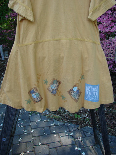 1998 Baseball Dress Games Lemonade Size 0: Yellow dress with deep V-neckline, decorative buttons, paneled breast pocket, drop waist seam, A-line lower sweep, and signature blue fish patch.
