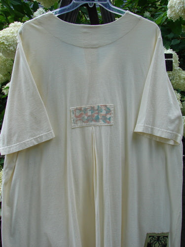 2000 Double Decker Pocket Top Pastel Fence Milk Size 2, featuring two stacked front pockets and a signature Blue Fish patch on organic cotton, with a pleated back and a flowing silhouette.
