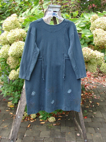 1999 Thermal Home Dress Paisley Peacock Size 0, featuring a round neckline, draw-string waist ties, and subtle hem stitching, hangs on an outdoor ladder, embodying the unique vintage style of Bluefishfinder.com.