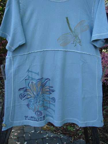 1998 Botanicals Snapdragon Top Birdsong Size 1, featuring dragonfly and botanical designs, rounded neckline, flared shape, vented sides with button closure, exterior stitchery, and organic cotton fabric.