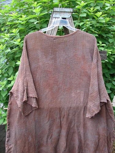 Barclay Crinkle Gauze Ana Tunic Dress Unpainted Mottled Copper OSFA displayed on a swinger, highlighting its wide three-quarter sleeves, seamless shoulders, and varying hemline in lightweight cotton gauze.
