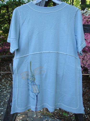 1998 Botanicals Snapdragon Top Birdsong Size 1, featuring a dragonfly design, rounded neckline, slightly flared shape, vented sides with button accents, and exterior stitchery, made from organic cotton.