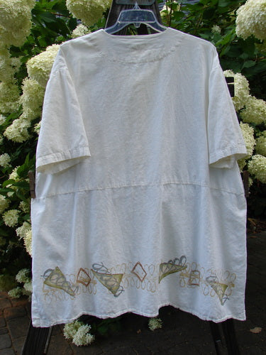 2000 Hemp Viscose Asymmetric Top Space White Size 1 featuring embroidered design, full button front, V-shaped neckline, side vented hem, and lower drop pocket.