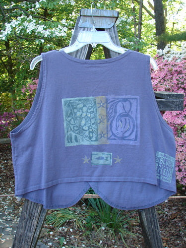 1996 Folk Vest Fish Star Purple Martin Size 2 displayed on a hanger, featuring a graphic design, slightly cropped rear, V neckline, shirttail front, and perfectly matching buttons.