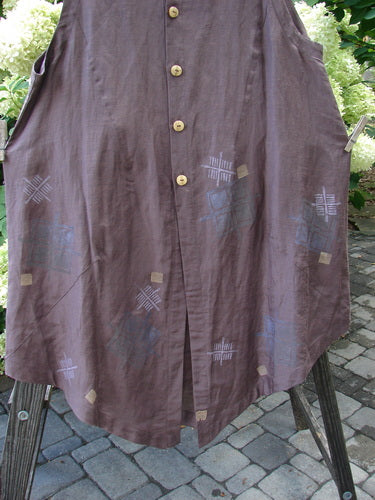 1998 NWT Hemp Silk Sanjo Vest Simplify Boxwood Size 2: A close-up of a long purple shirt with wooden buttons, a dipped varying hemline, and a Blue Fish patch.