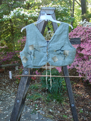 1997 Beachcomber's Vest Undersea Lagoon Size 2 displayed on a wooden stand, showcasing front and back lacings, super wide boxy crop shape, and colorful undersea theme paint.