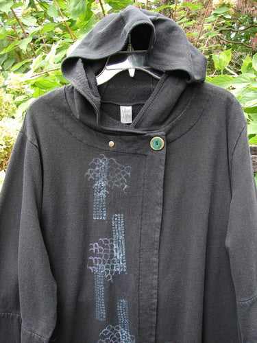 Barclay Fleece Single Button Hooded Jacket Grid Black Size 2 features an off-center snap closure, wide sleeves, and grid-themed prints against a leafy backdrop, epitomizing BlueFishFinder's vintage creative expression.