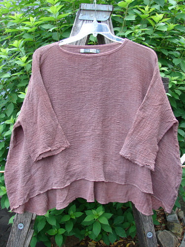 Barclay Crinkle Gauze Crop Top Mottled Monrovian Clay OSFA displayed on a swinger, highlighting its high-low hemline, generous square shape, and three-quarter dolman sleeves with frayed edges.