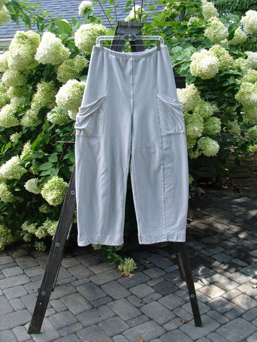 Barclay Interlock Cuff Toboggan Reversible Pant Unpainted Pebble Size 1, displayed on a wooden rack, showcasing its cozy fleece cuffed lowers and full elastic waistband, embodying Bluefishfinder.com's unique vintage style.