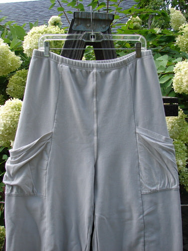 Barclay Interlock Cuff Toboggan Reversible Pant Unpainted Pebble Size 1 displayed on an outdoor clothesline, showcasing its heavy-weight stretch cotton interlock material with fleece cuffs and oversized side pockets.
