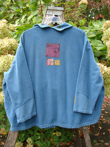 Barclay Patched Flannel Frolic Jacket Garden Blue Teal Size 2 displayed on a ladder, showcases a loose fit with decorative back patches and a unique collar, emphasizing Bluefishfinder.com's vintage, expressive style.