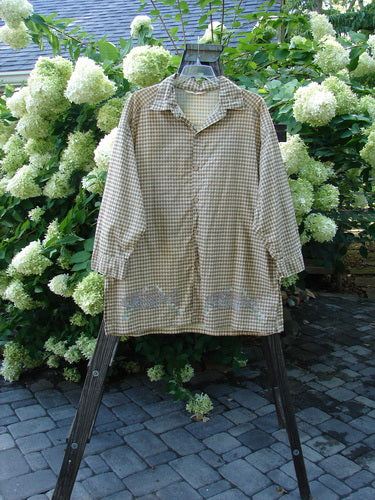 1996 Woven Tourist Top Fish Border White Pine Gingham OSFA displayed on a rack, featuring a button front, rollable lower sleeves, stand-up collar, and vented sides.