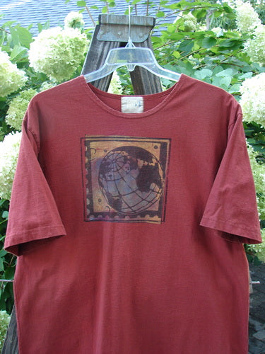 1998 Men's Artist Choice Short Sleeved Tee Earth Brick Size 2 featuring a globe illustration on the front, crafted from heavy-weight organic cotton with a softly ribbed neckline and boxy, longer shape.