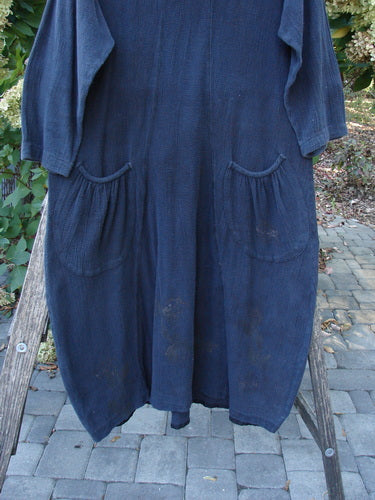 1998 Limited Edition Gauze Thostle Dress Soft Florals Raven Size 1 draped on a ladder, showcasing its hourglass shape, long sleeves, gathered hip pockets, and softly rolled neckline.