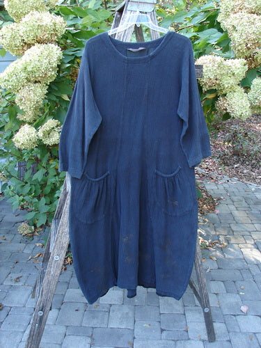 1998 Limited Edition Gauze Thostle Dress Soft Florals Raven Size 1, showcasing a loose-fitting, calf-length design with a softly rolled neckline, three-quarter sleeves, and two front elastic-topped pockets.