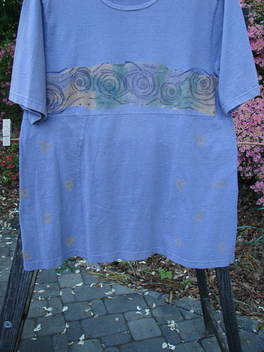 1993 3 Square Dress Wind Band Periwinkle OSFA displayed on a stand, featuring a rounded neckline, vertical front and back lines, and sectional panels with a signature Blue Fish patch.
