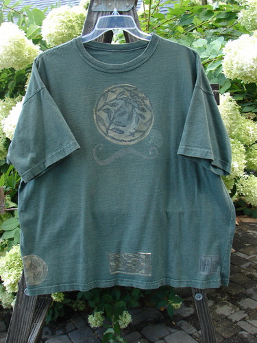 1994 Short Sleeved Tee with circular fan fare design on a green tee. Vintage, one size fits all. Made from mid weight cotton.