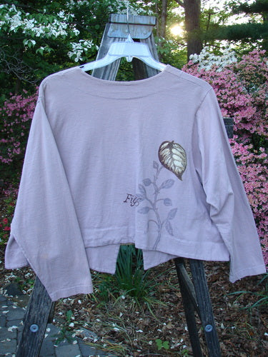 1998 Botanicals Calla Jacket Leaf Passiflora Size 1 displayed on a hanger, featuring a long-sleeved design with a deep V neckline, single ceramic closure, and distinctive hemlines.