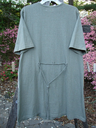 2000 Cotton Hemp 3 Block Cardigan Sun Pocket Loden Size 1 displayed on a wooden pole, showcasing its V neckline, colorful painted pockets, and original Blue Fish buttons.