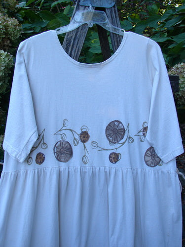 1994 Flower Garden Dress Garden Trail Altered Ecru Size 2, featuring a scooped neckline, elbow-length sleeves, and a drop-waist skirt with brown seed-pod motifs, perfect for garden parties.