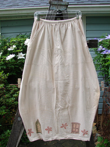 1993 Resort Bell Skirt Window Teadye Size 2 hanging on a clothesline, showcasing nifty seams, front pockets, a pegged shape, and a rear kick vent from Bluefishfinder.com.