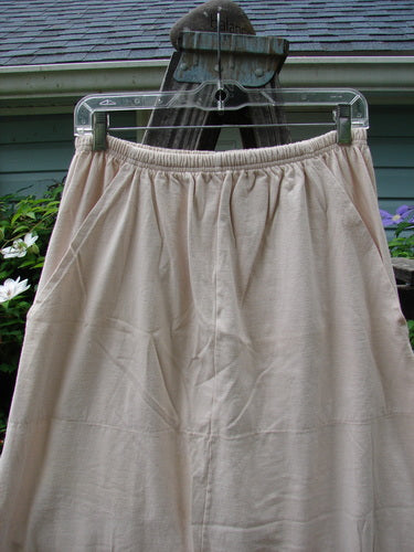 1993 Resort Bell Skirt in teadye on a swinger, featuring horizontal and vertical seams, unique front pockets, slightly pegged shape, and a rear kick vent, from Bluefishfinder.com.