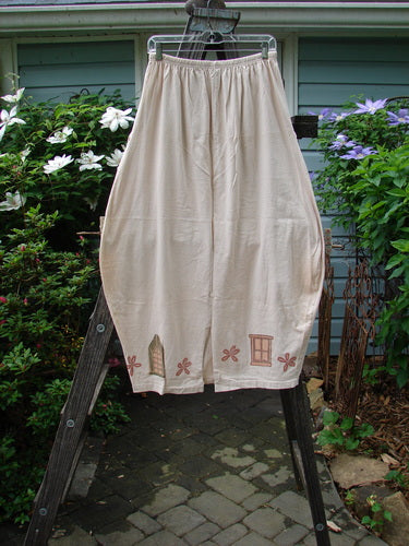 1993 Resort Bell Skirt in Teadye cotton, displayed on a ladder, showcasing its horizontal and vertical seams, front pockets, slightly pegged shape, and rear kick vent.