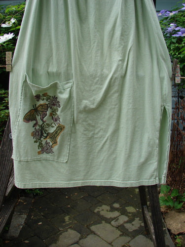 1994 Pocket Skirt Magical Garden Seawater Size 1, featuring a full A-lined shape, lower front pocket with garden theme paint, single side vent, and drawcord waistline.
