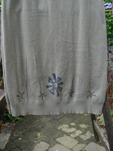 1996 Cotton Cashmere Skirt Pinwheel Green Shade on Shade Size 2 displayed on a rack, showcasing its densely knit fabric, full elastic drawcord waistband, and deep side pockets.