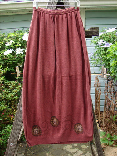 1997 Cotton Cashmere Skirt Pinwheel Marled Stained Glass Size 2 on a clothes rack, showcasing its full elastic waistband and deep side pockets with a slightly tapered hem.